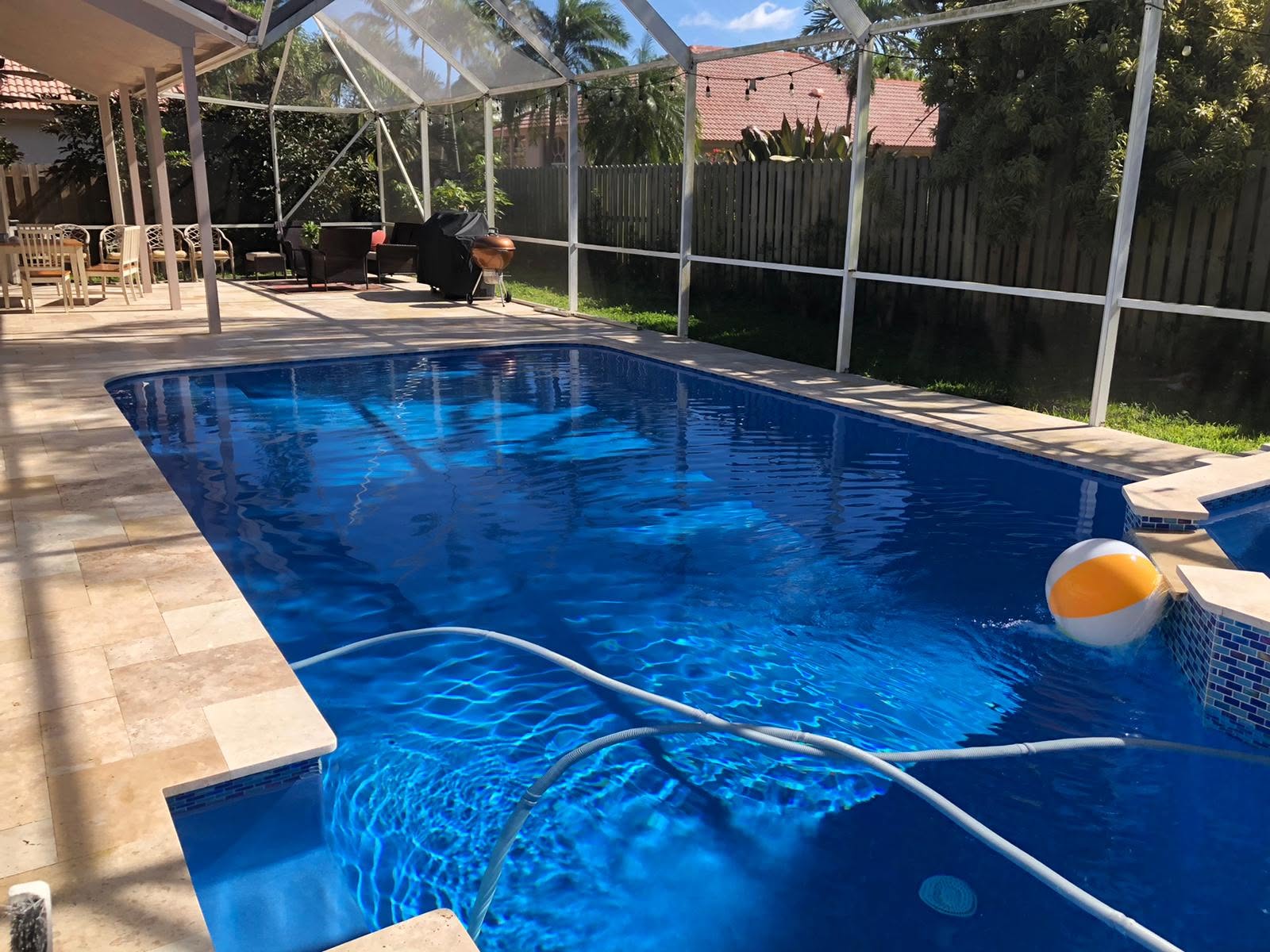 A crystal-clear residential pool maintained by Clean Water Pool Services